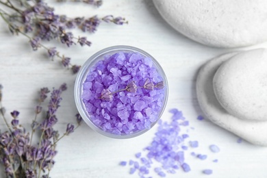 Flat lay composition with lavender flowers and natural cosmetic on wooden background