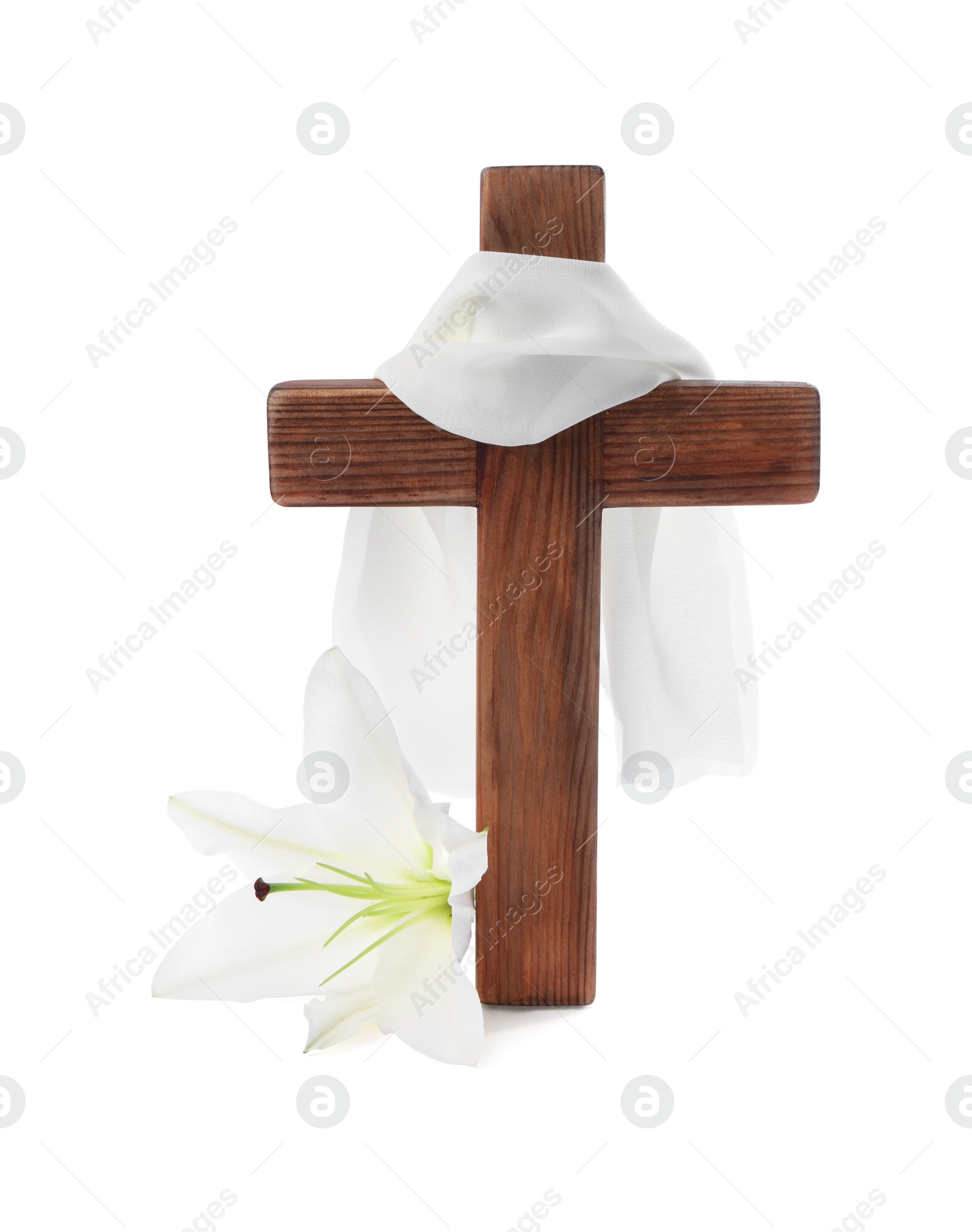 Photo of Wooden cross, cloth and lily flower on white background. Easter attributes