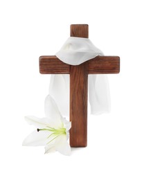 Wooden cross, cloth and lily flower on white background. Easter attributes