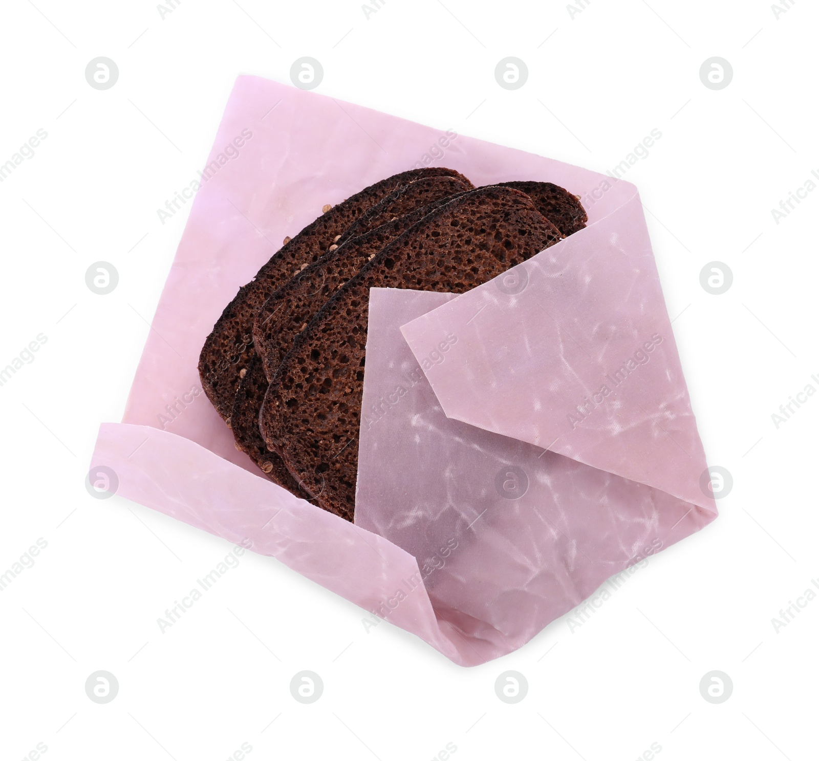 Photo of Bread slices in pink beeswax food wrap on white background, top view