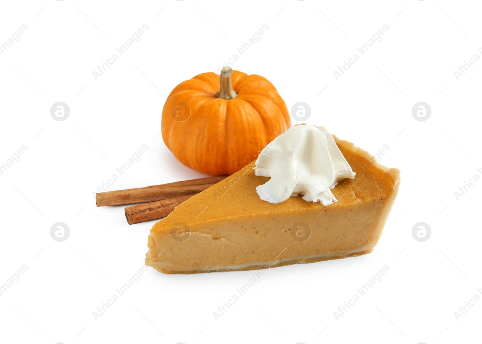 Photo of Piece of delicious pie with whipped cream, pumpkin and cinnamon sticks isolated on white