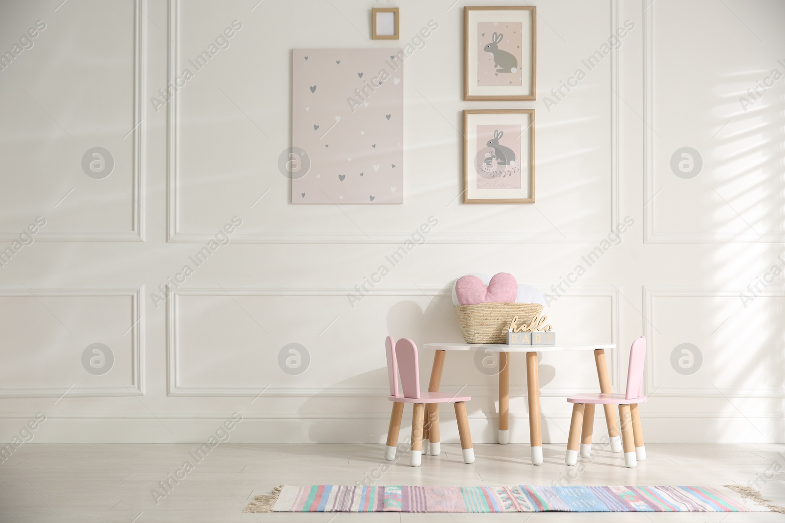 Photo of Baby room interior with stylish furniture and toys