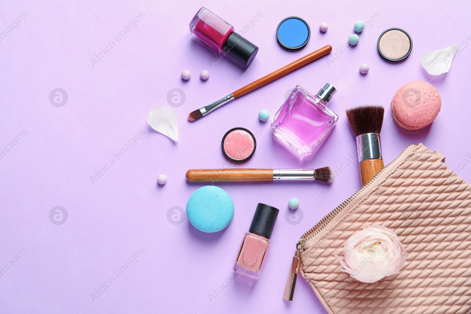 Photo of Makeup products with cosmetic bag on color background