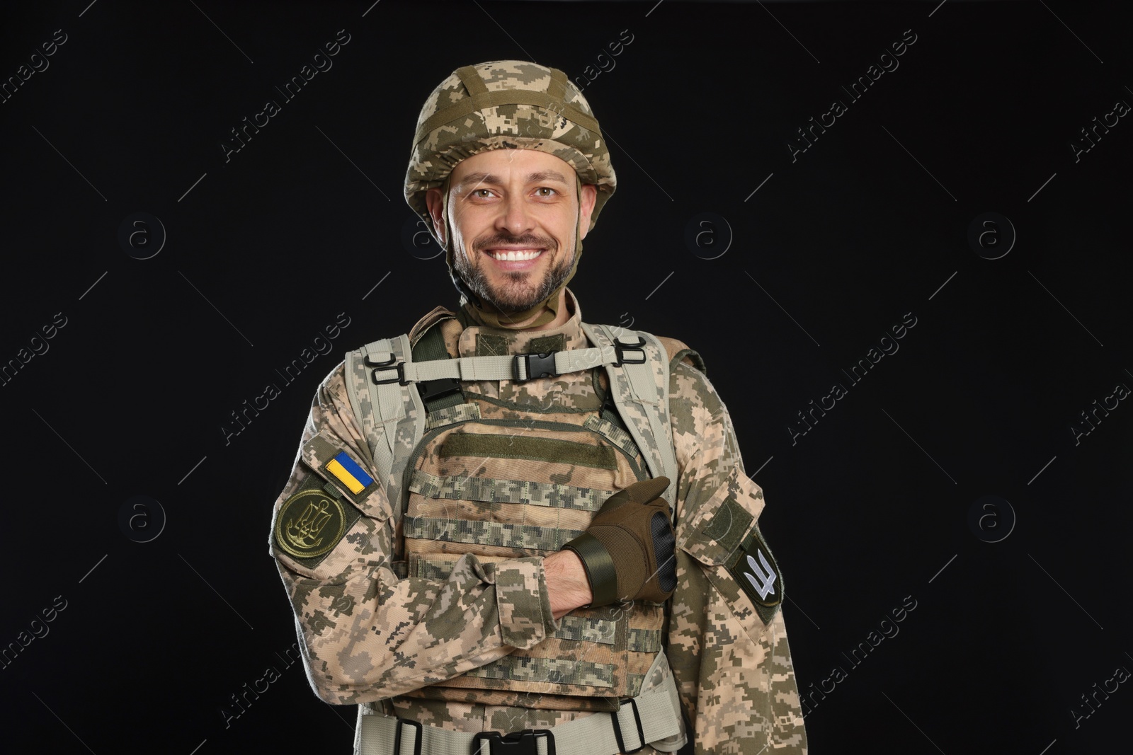 Photo of Soldier in Ukrainian military uniform on black background