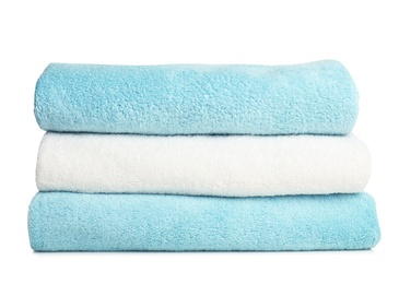 Folded soft terry towels on white background