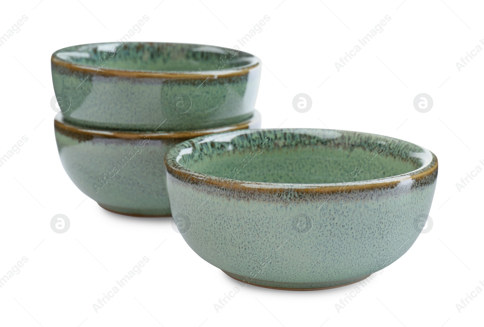 Photo of Beautiful green ceramic bowls on white background