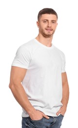 Photo of Man wearing blank t-shirt on white background. Mockup for design