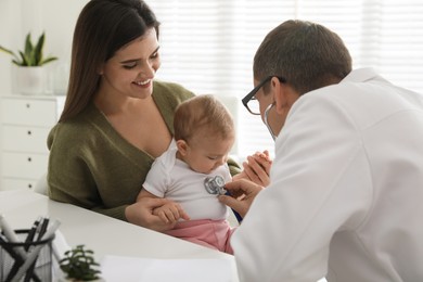 Mother with her cute baby visiting pediatrician in clinic