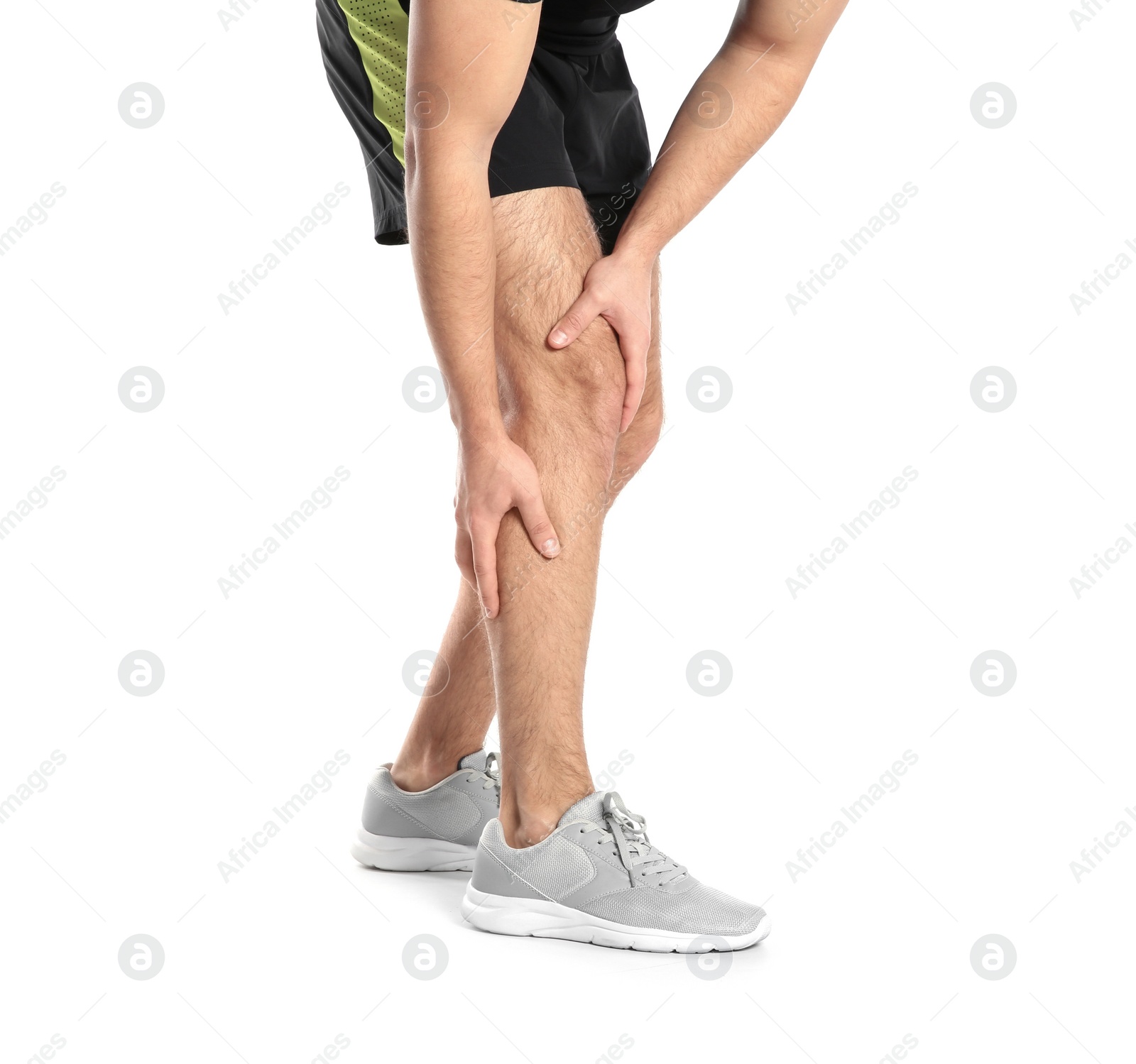 Photo of Man suffering from leg pain on white background, closeup