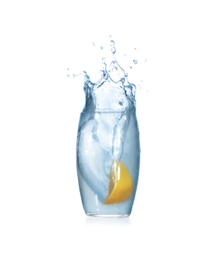 Photo of Lemon slice falling into glass of water on white background