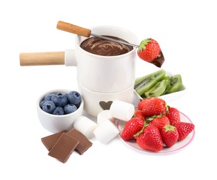 Photo of Fondue pot with melted chocolate, fresh berries, kiwi, marshmallows and fork isolated on white
