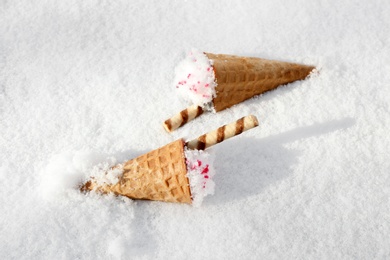 Waffle cones with ice cream on snow