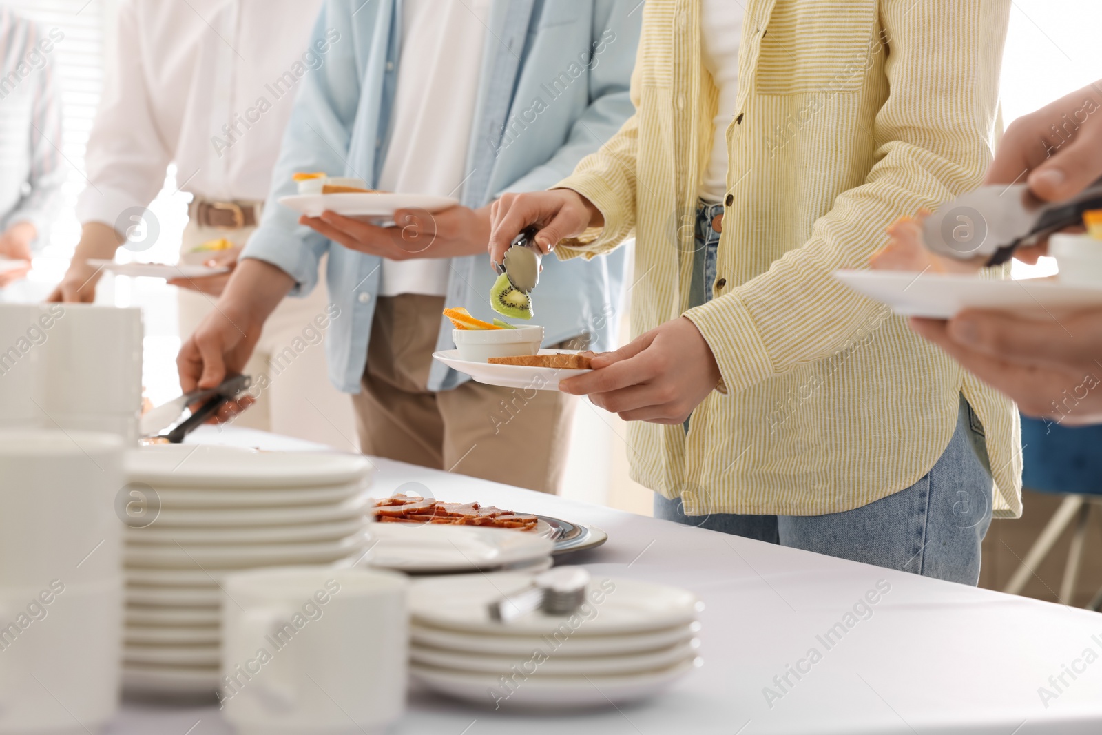 Photo of People taking food during breakfast, closeup. Buffet service