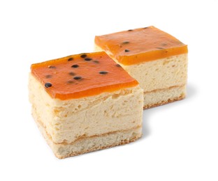 Pieces of cheesecake with jelly on white background