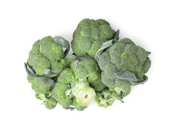 Photo of Pile of fresh raw green broccoli isolated on white, top view