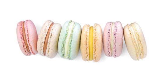 Photo of Different delicious colorful macarons on white background, top view