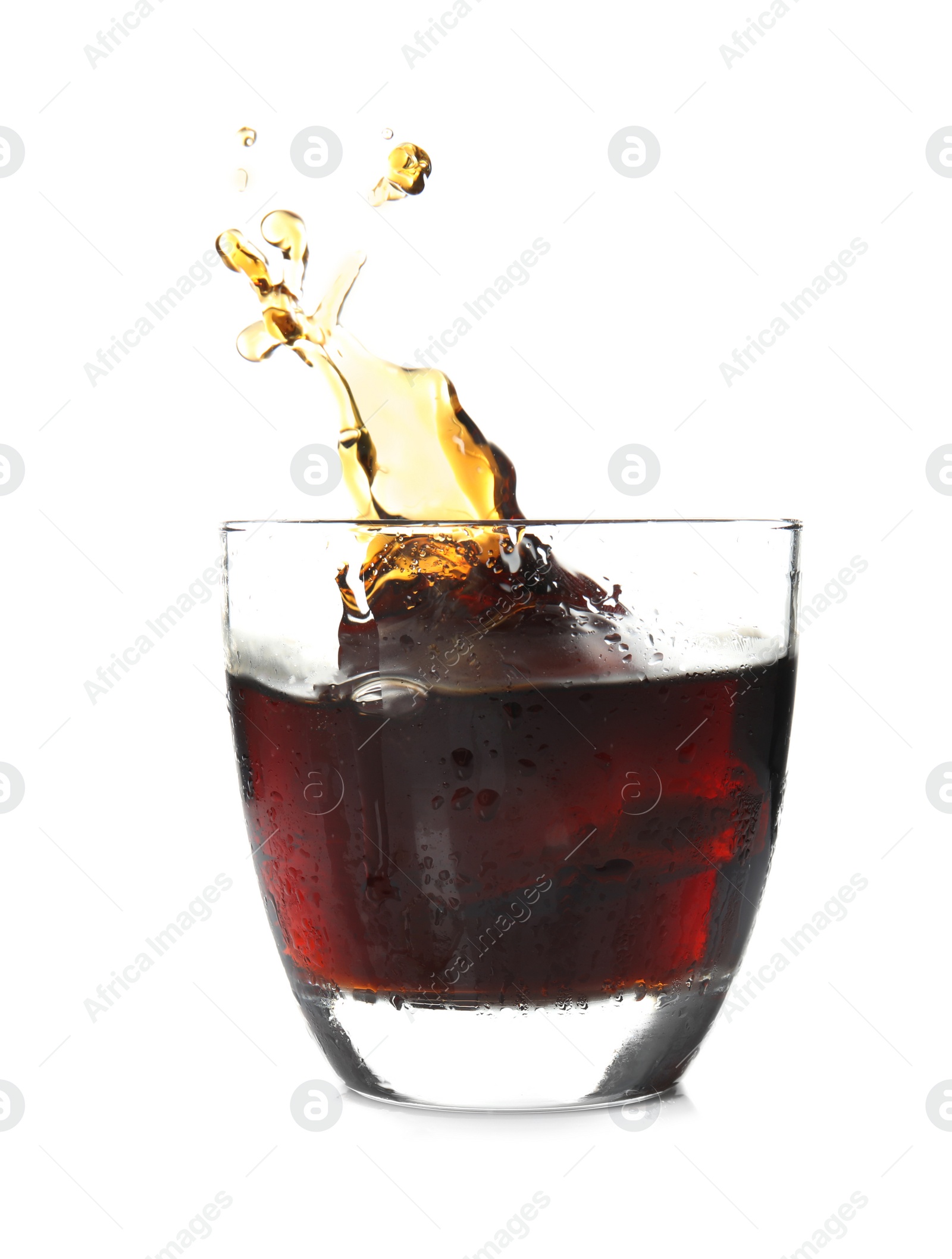 Photo of Splash of cola in glass on white background