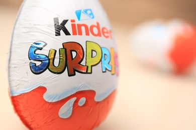 Slynchev Bryag, Bulgaria - May 25, 2023: Kinder Surprise Egg on blurred background, closeup. Space for text