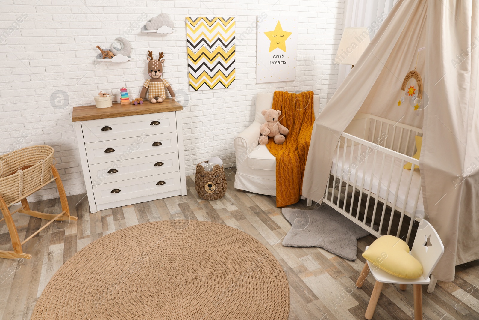 Photo of Stylish baby's room with comfortable cot. Interior design