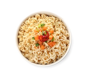 Photo of Tasty instant noodles with vegetables in bowl isolated on white, top view