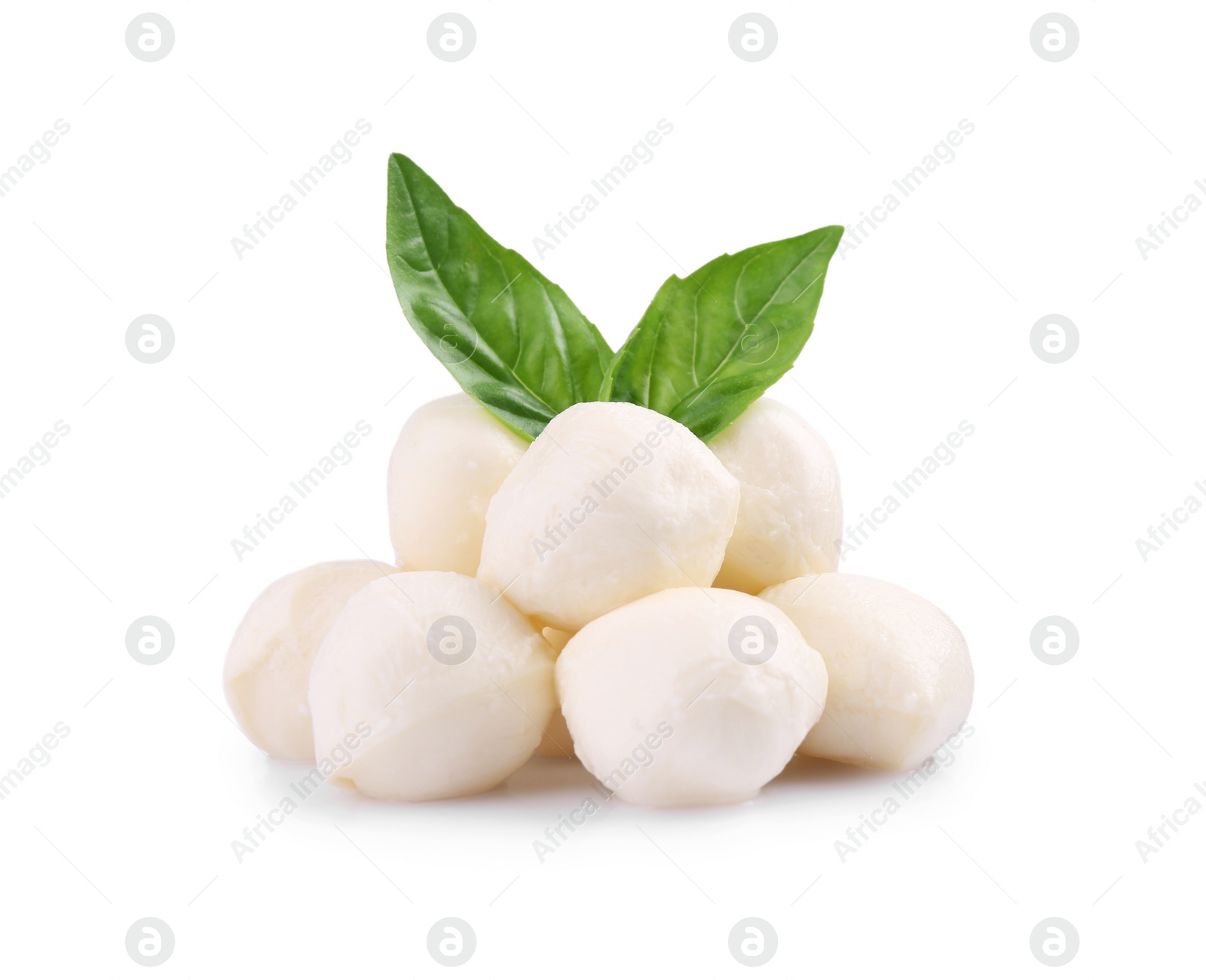 Photo of Tasty mozzarella balls and basil leaves isolated on white