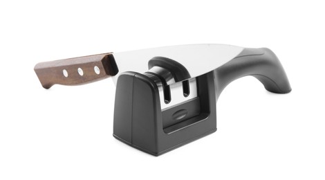 Photo of Modern handheld sharpener and knife on white background