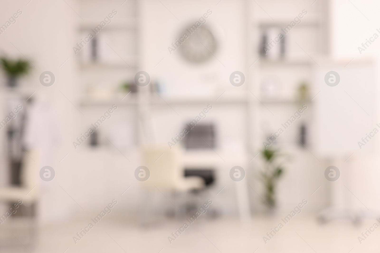 Photo of Blurred view of medical office interior with doctor's workplace