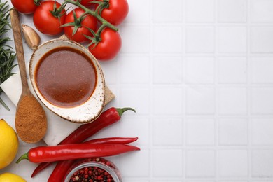 Photo of Flat lay composition with fresh marinade and different ingredients on white tiled table. Space for text