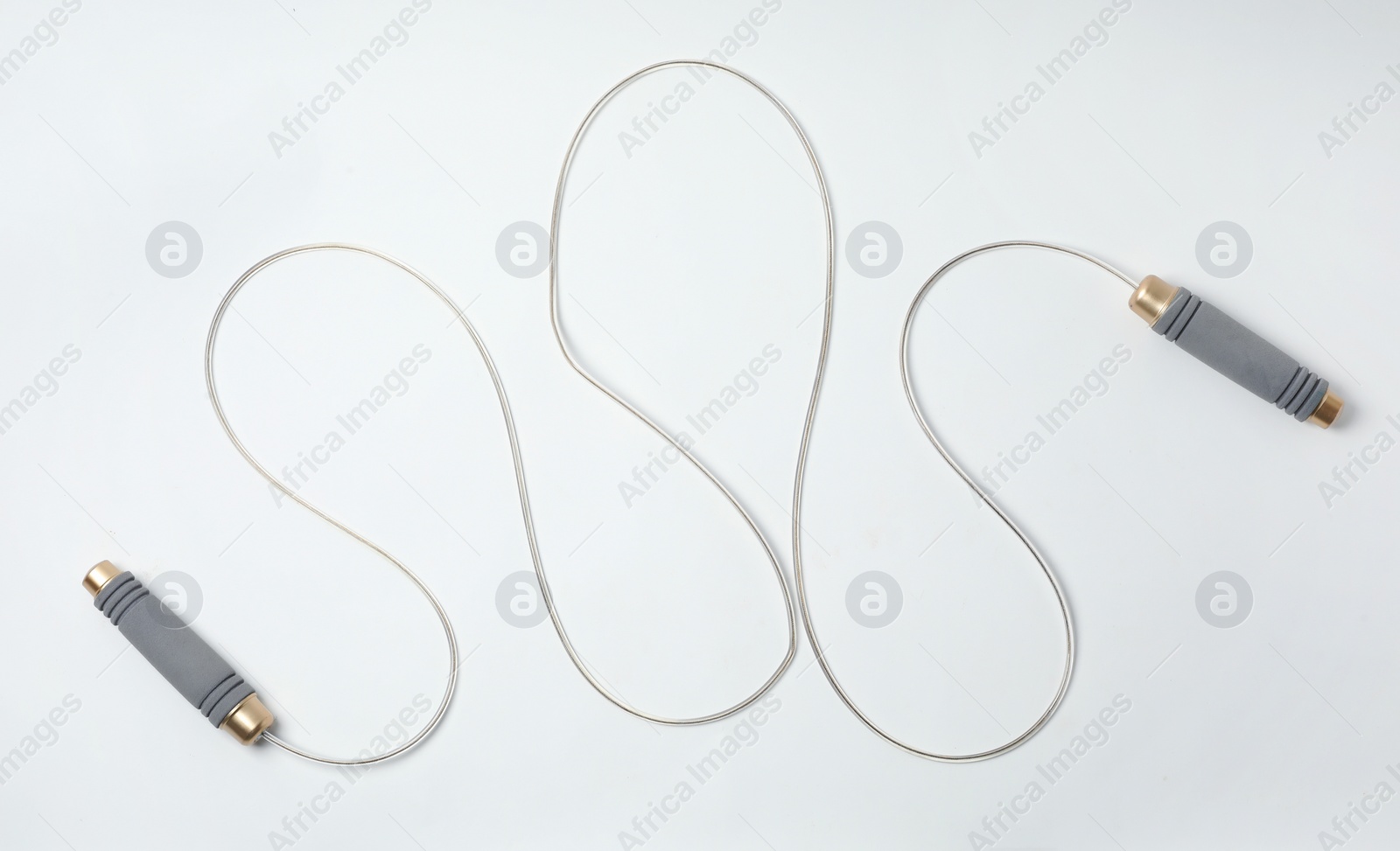 Photo of Jump rope on white background, top view