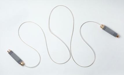 Photo of Jump rope on white background, top view