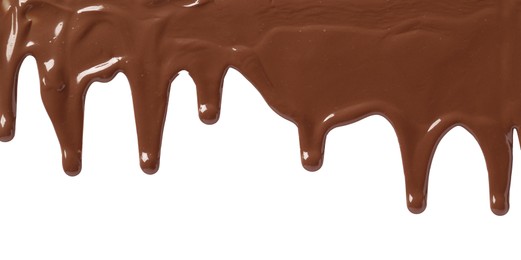 Photo of Tasty melted milk chocolate pouring down on white background