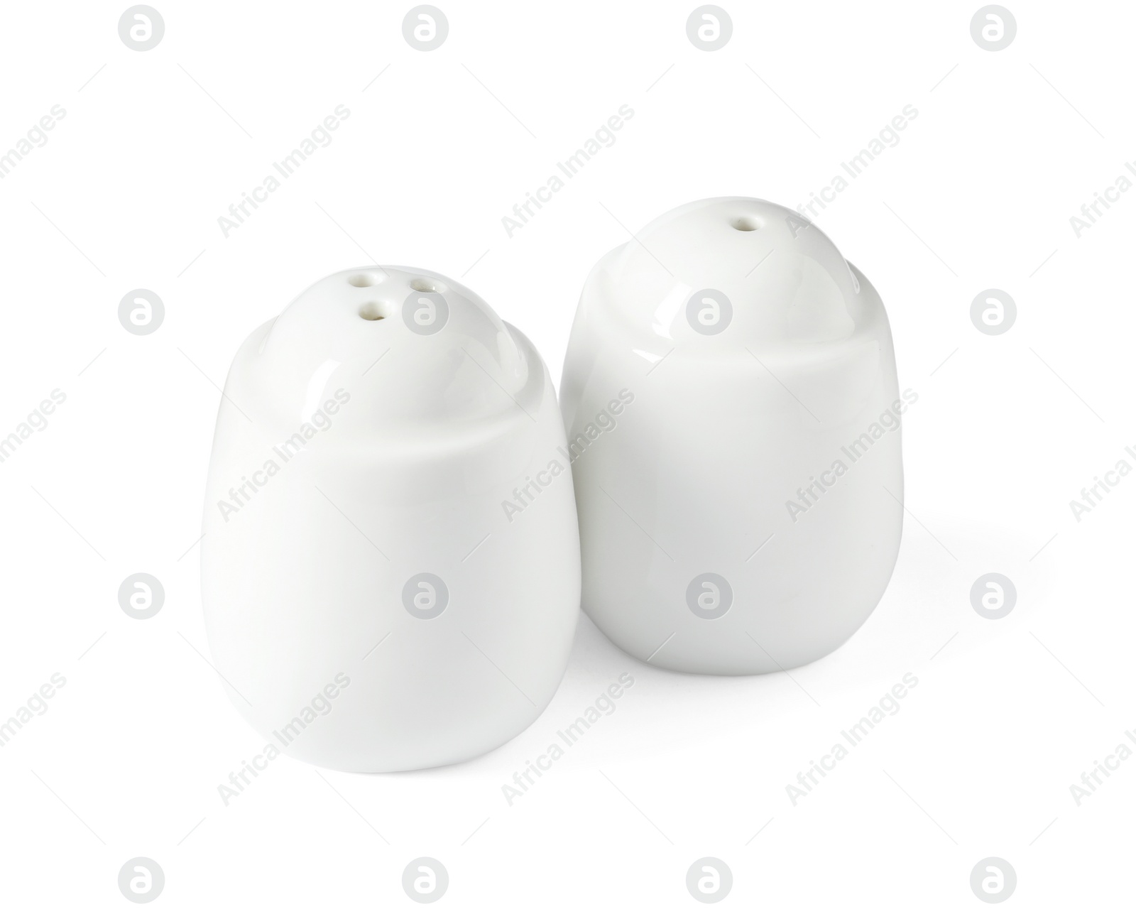 Photo of Salt and pepper shakers isolated on white