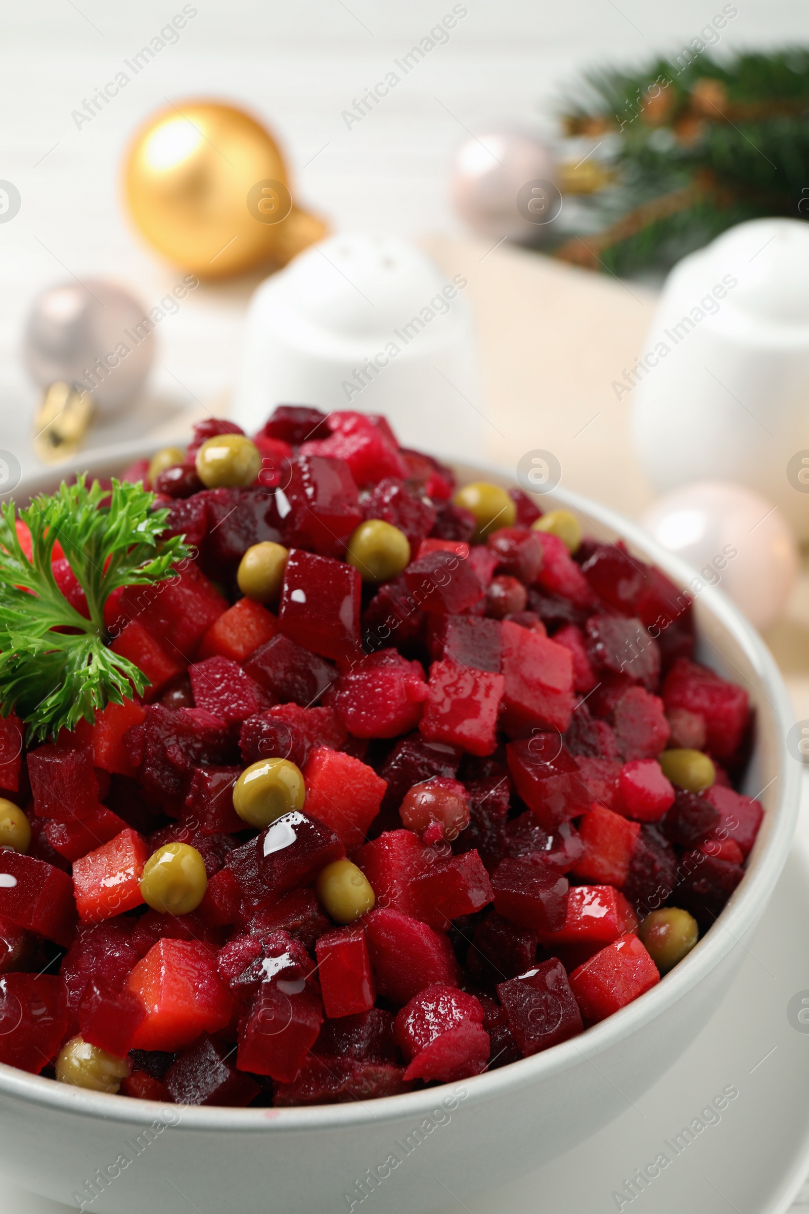 Photo of Traditional Russian salad vinaigrette in bowl, closeup