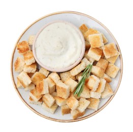 Photo of Delicious crispy croutons with rosemary and sauce on white background, top view