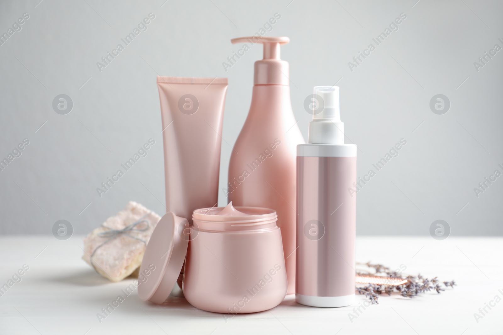 Photo of Set of hair care cosmetic products on white table