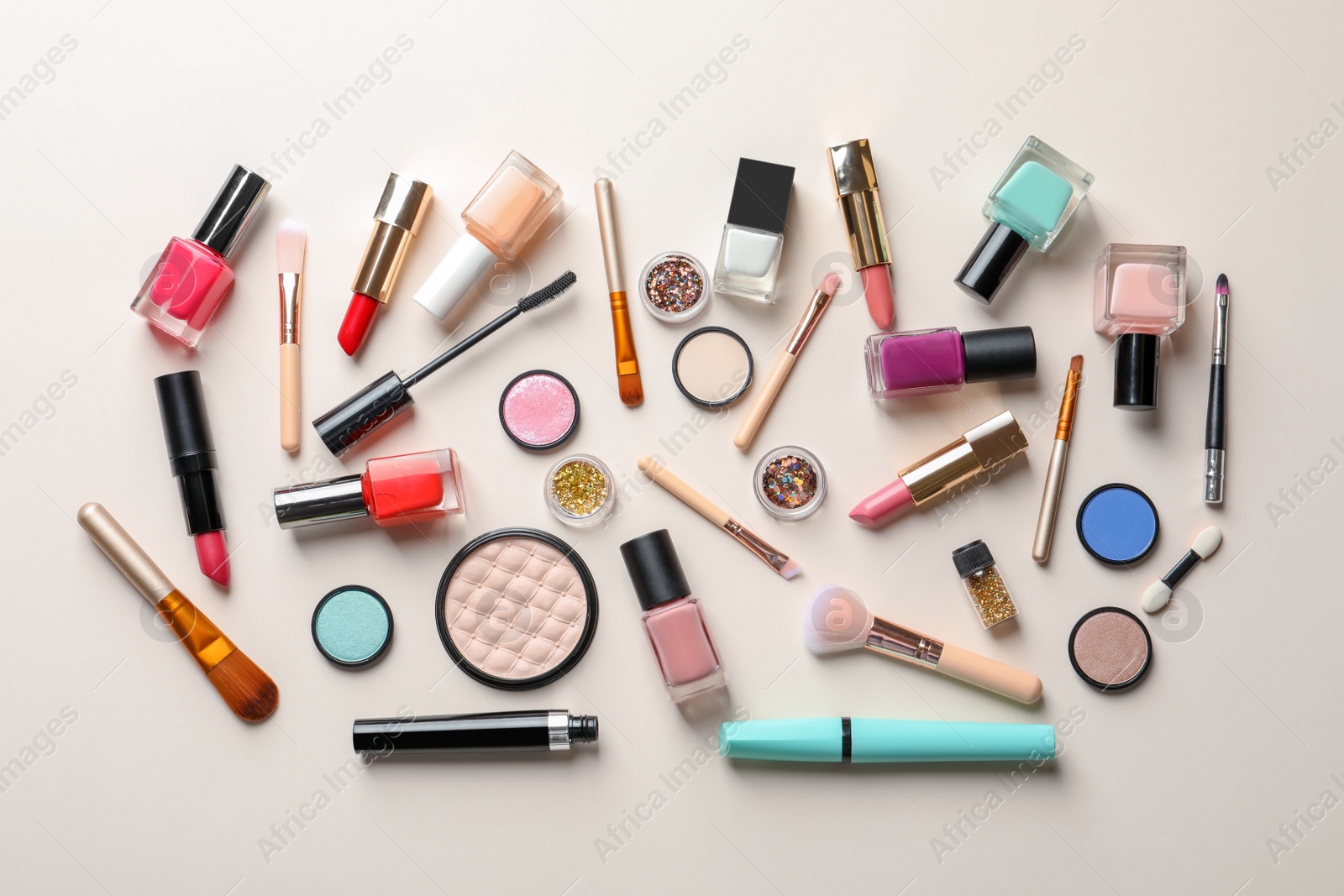 Photo of Flat lay composition with decorative cosmetics on color background