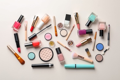 Flat lay composition with decorative cosmetics on color background