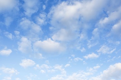 Picturesque view of beautiful fluffy clouds in light blue sky