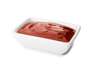 Photo of Rectangular bowl with spicy chili sauce on white background