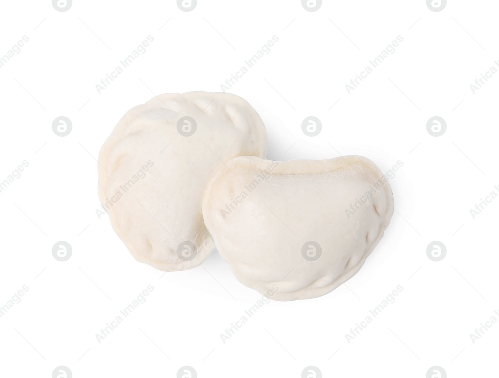Photo of Raw dumplings (varenyky) isolated on white, top view