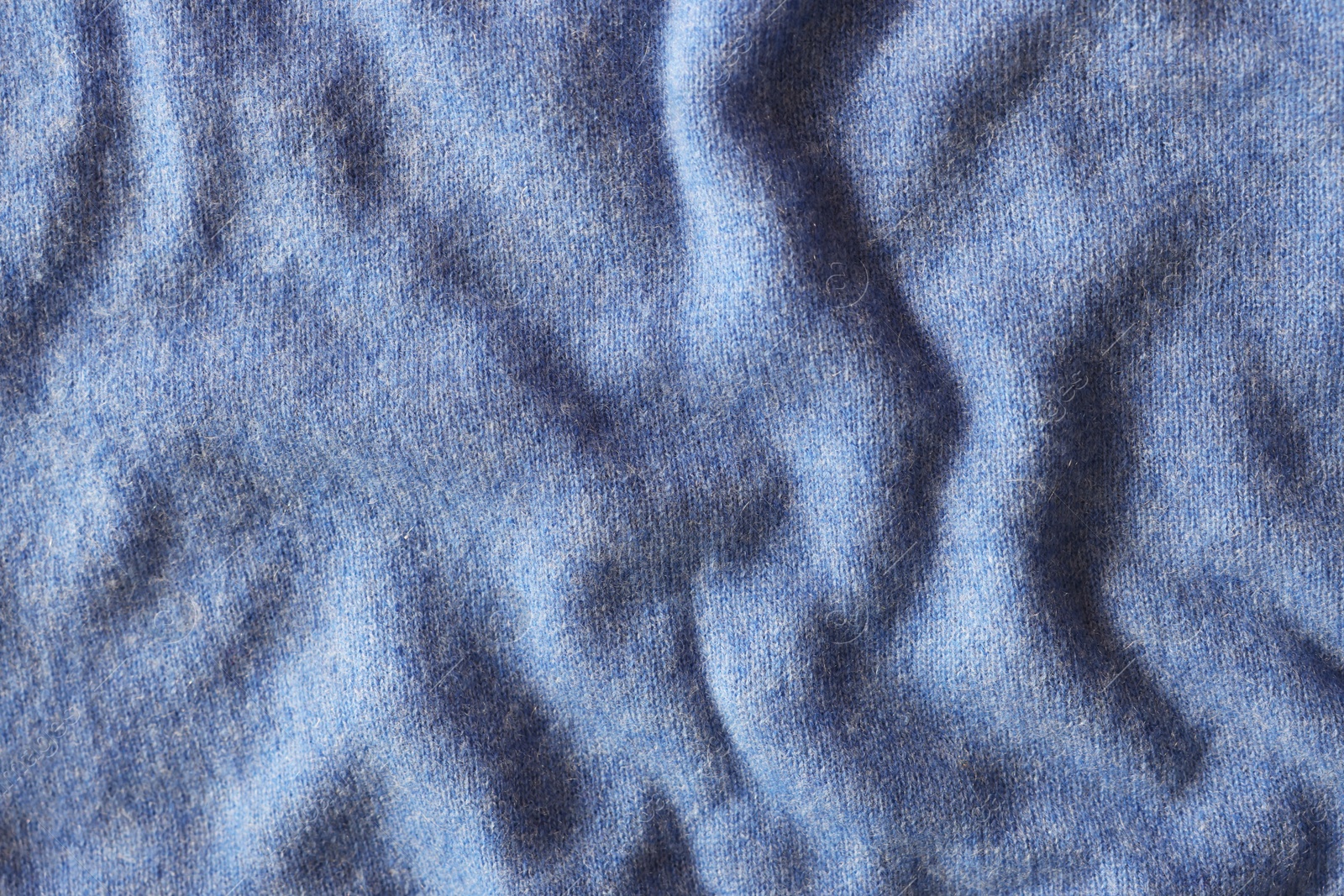 Photo of Beautiful blue fabric as background, top view