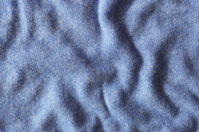 Photo of Beautiful blue fabric as background, top view