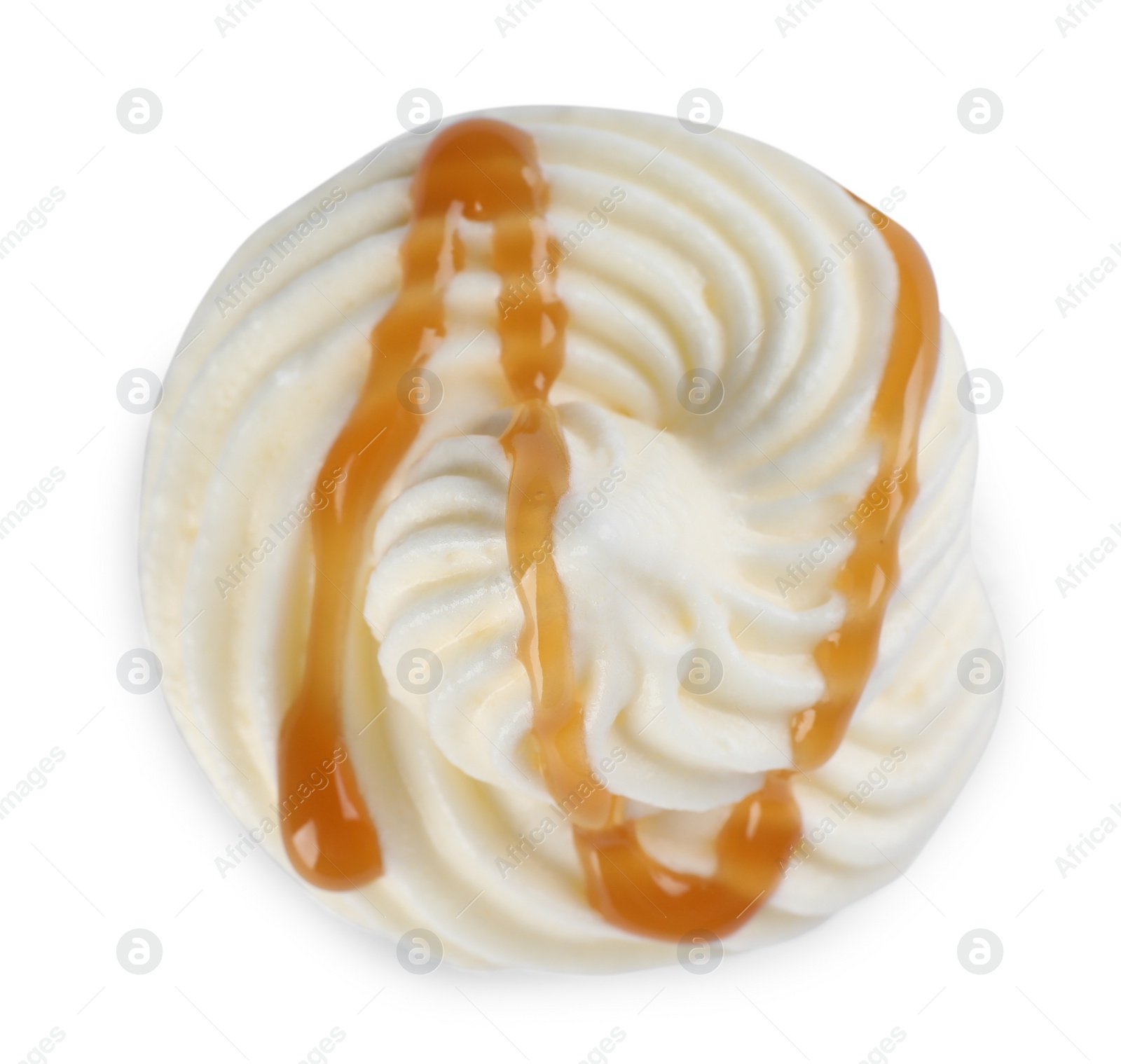 Photo of Delicious fresh whipped cream with caramel sauce isolated on white, top view