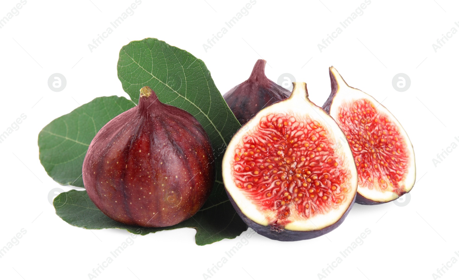 Photo of Fresh juicy purple figs and green leaves on white background