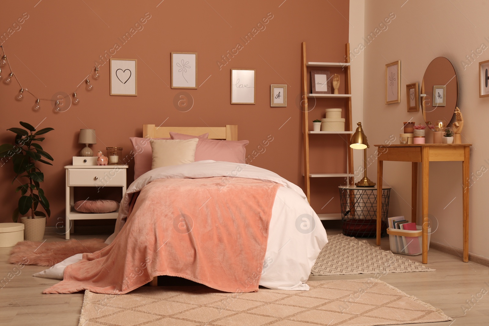 Photo of Teenage girl's bedroom interior with stylish furniture and beautiful decor elements