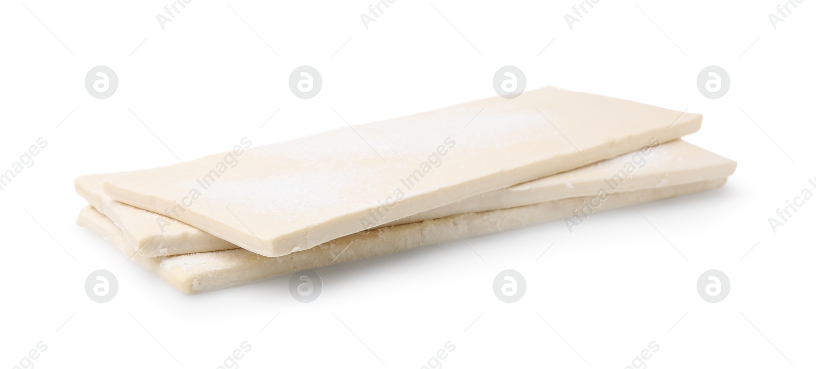 Photo of Raw puff pastry dough isolated on white