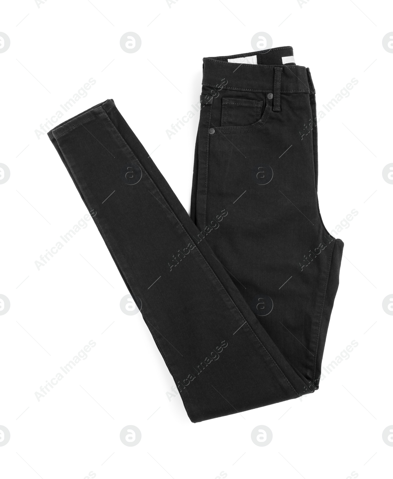 Photo of Folded black jeans isolated on white, top view