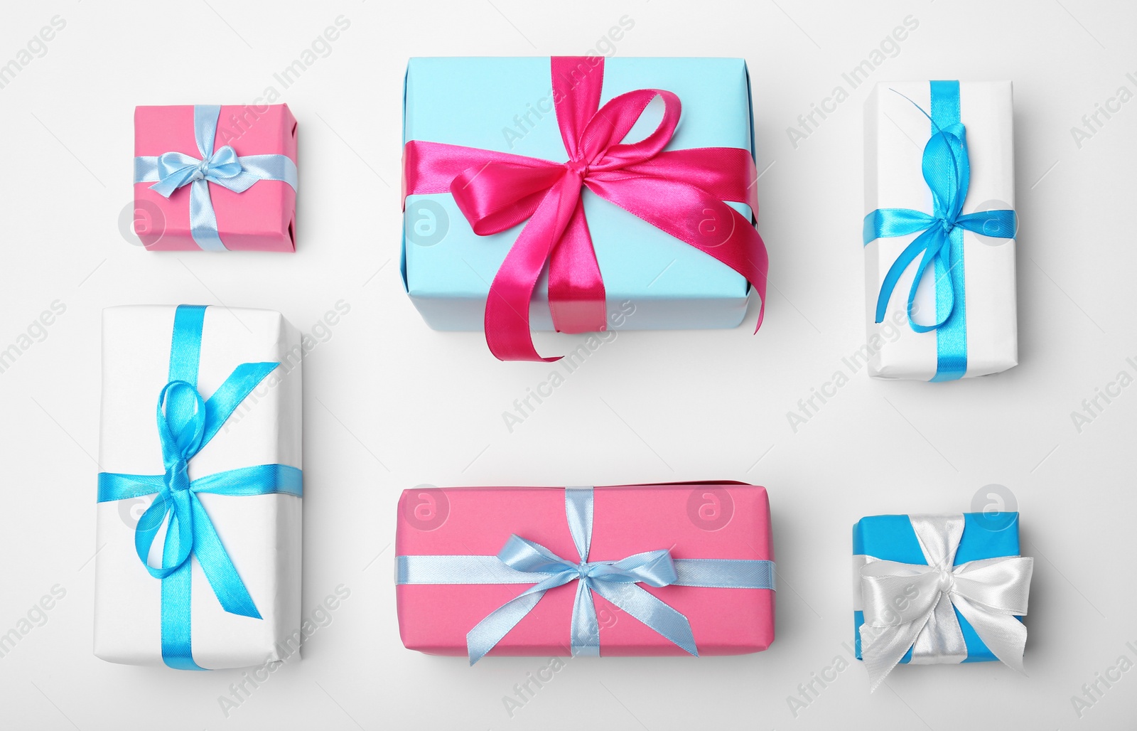 Photo of Flat lay composition with beautiful gift boxes on white background