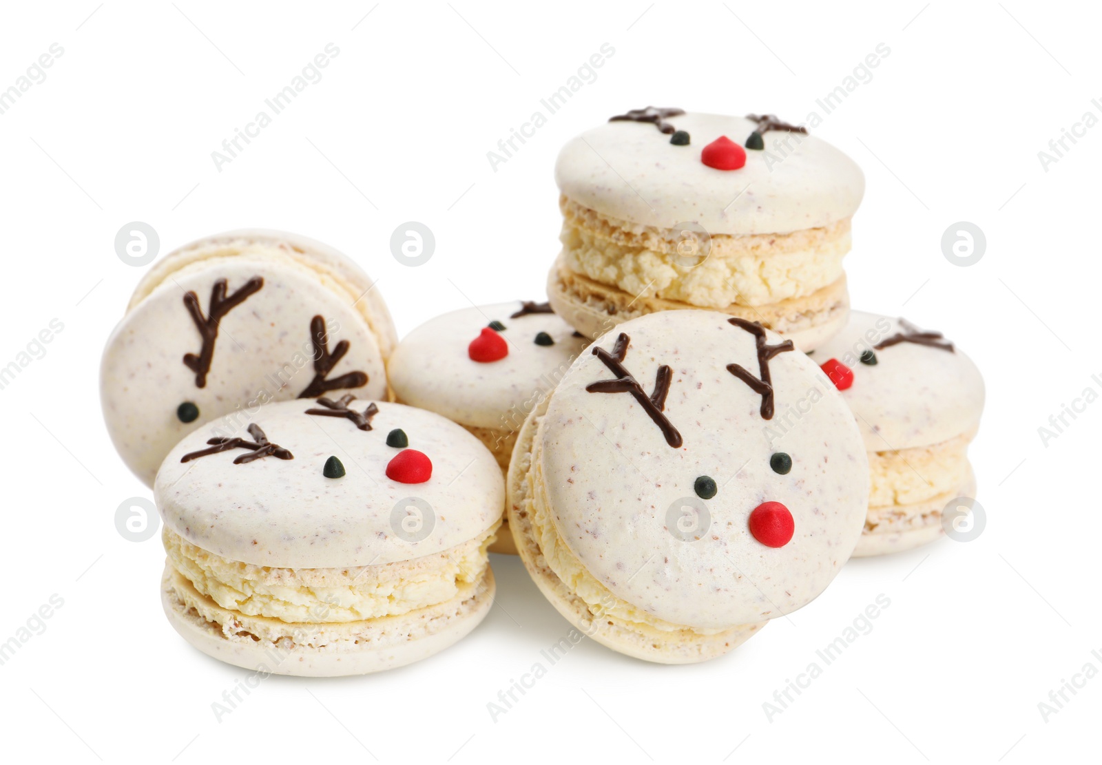 Photo of Pile of Christmas reindeer macarons on white background