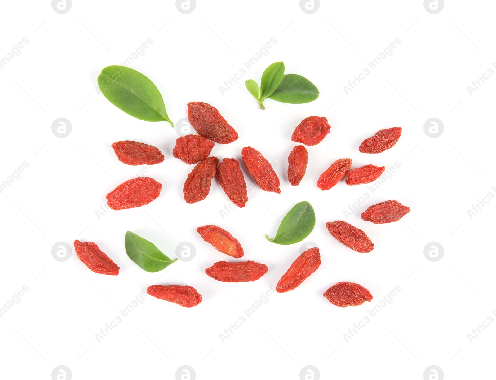 Photo of Tasty dried goji berries and leaves on white background, top view